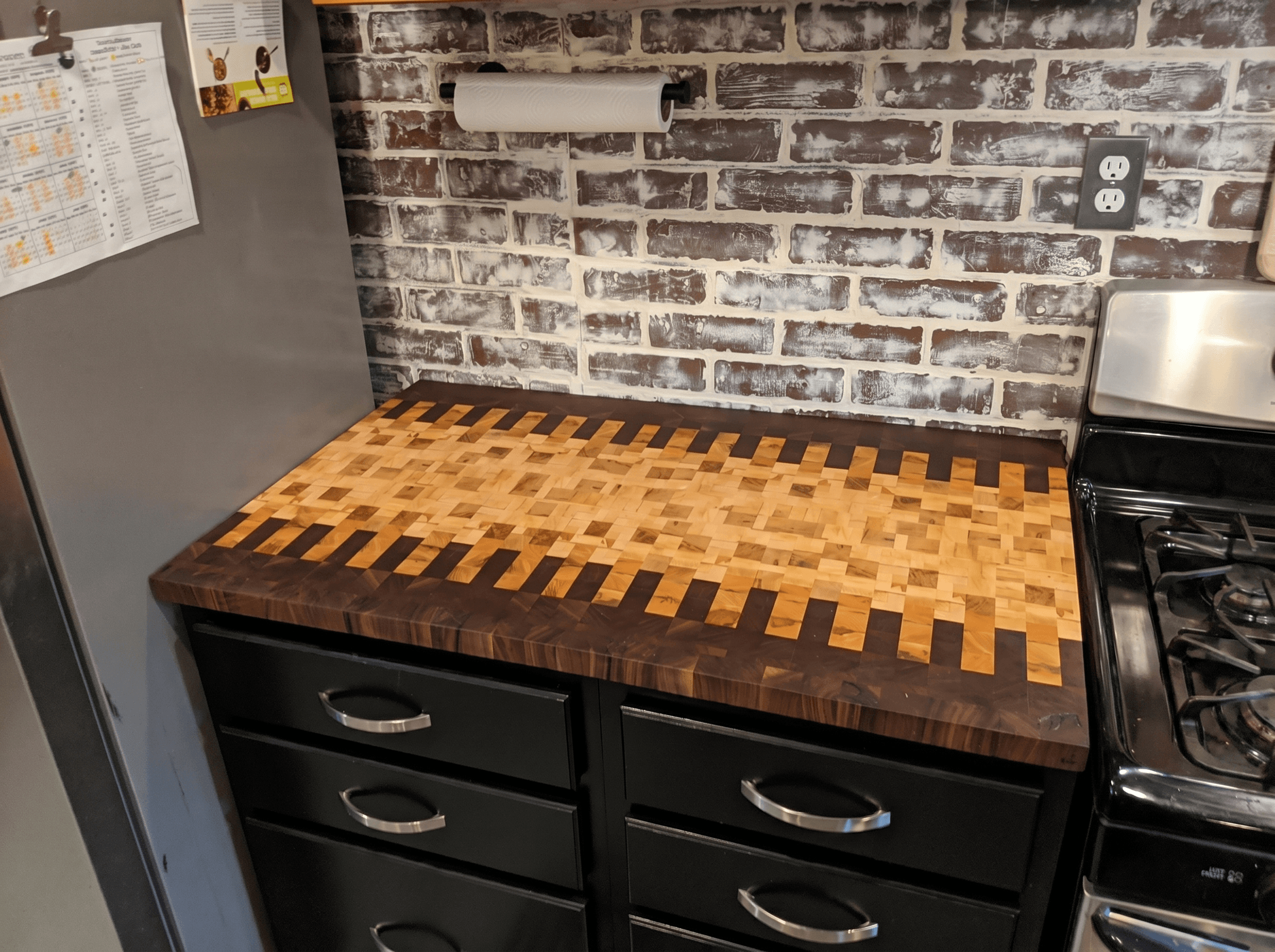 Butcher Block Counters in a Black Kitchen